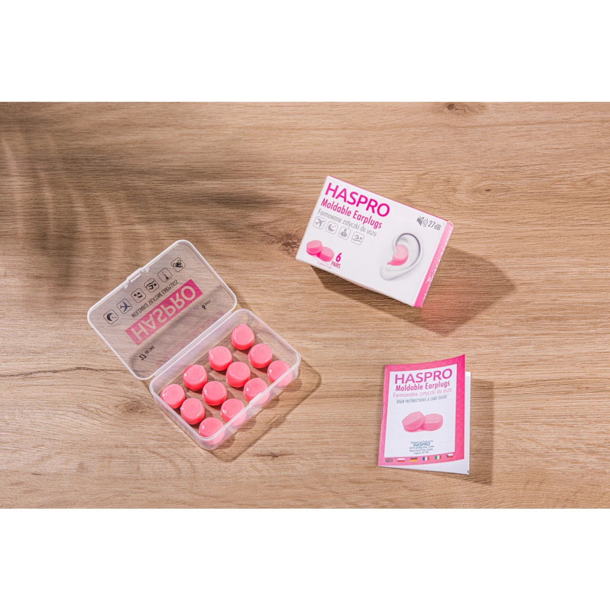 HASPRO Moldable silikonikorvatulpat suojaamaan vedeltä ja melulta, pinkki. Pakkaus sisältää muovisen suojakotelon jan käyttöohjeen.