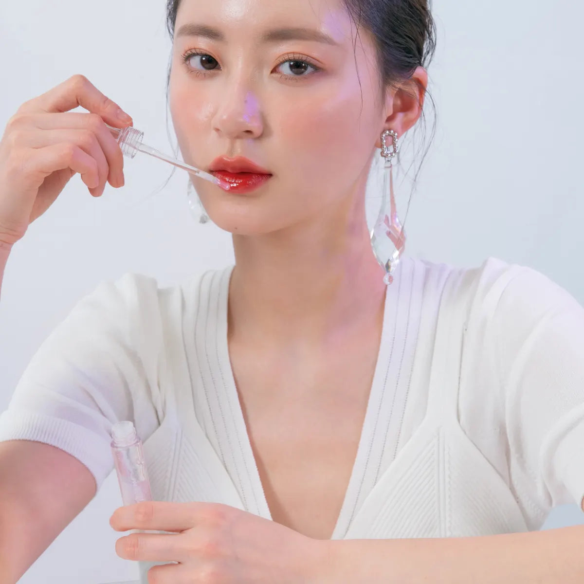 ROM&ND Glasting Water Gloss 00 Meteor Track sopii myös huulipunan päälle